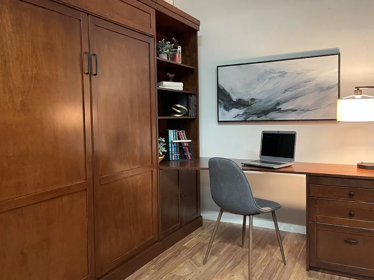 Dual Purpose Desk Murphy Bed called the Ryland Queen Wallbed with 32" desk and pedestal cabinet set in caramel wood finish